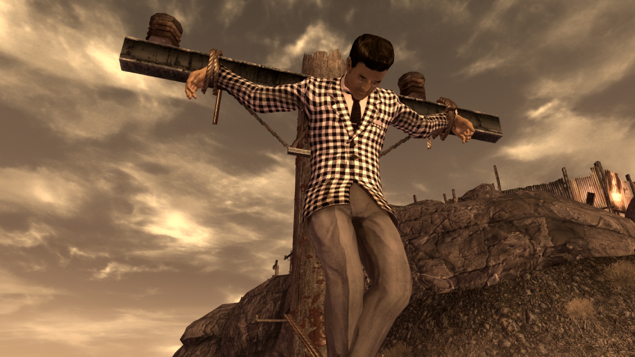 A screenshot of Benny crucified by Caeser's Legion from Fallout: New Vegas