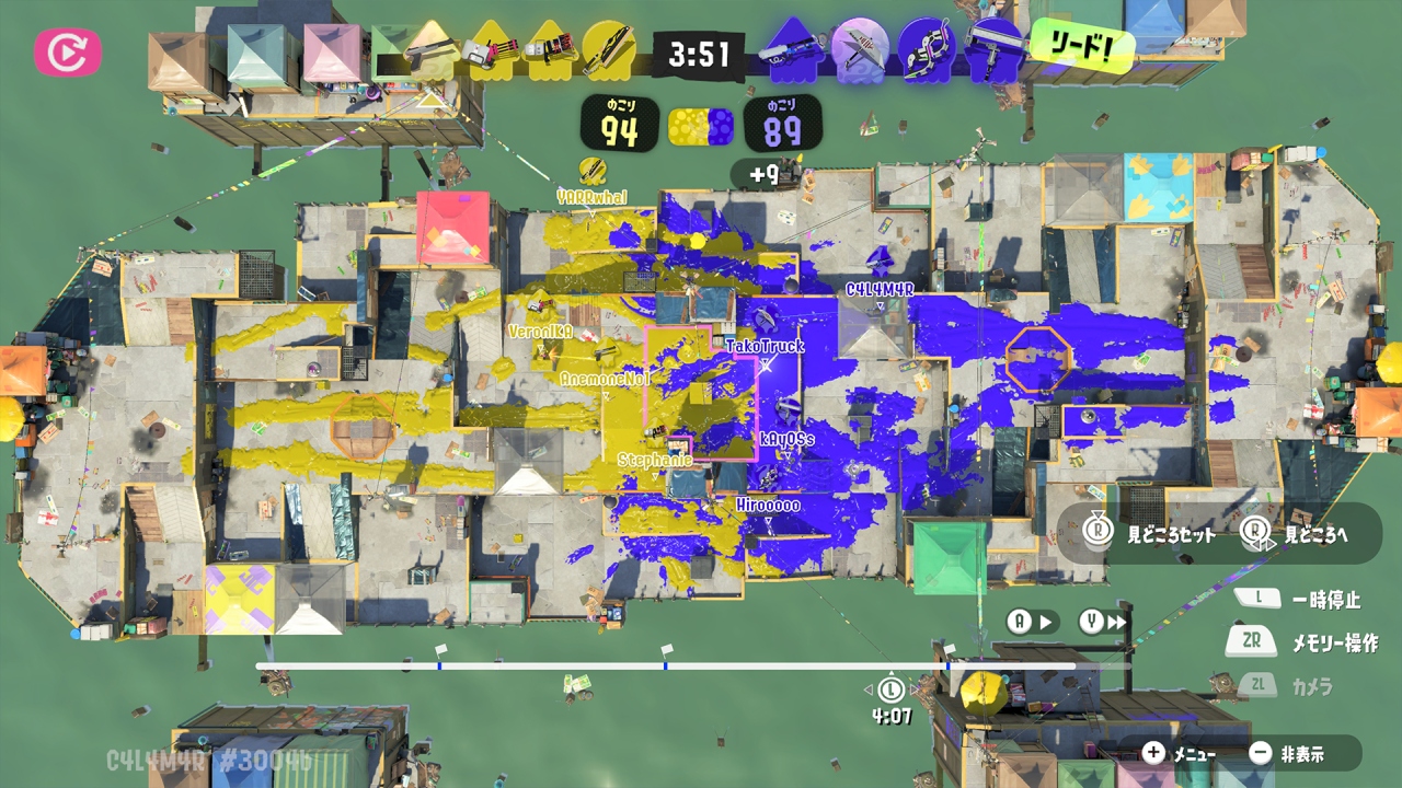 A screenshot from Splatoon 3's replay mode, showcasing a top-down view of Hagglefish Market in the middle of a match of Splat Zones.