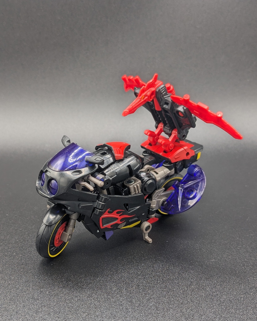 A picture of Flamewar in vehicle mode, with Fireglide in beast mode.