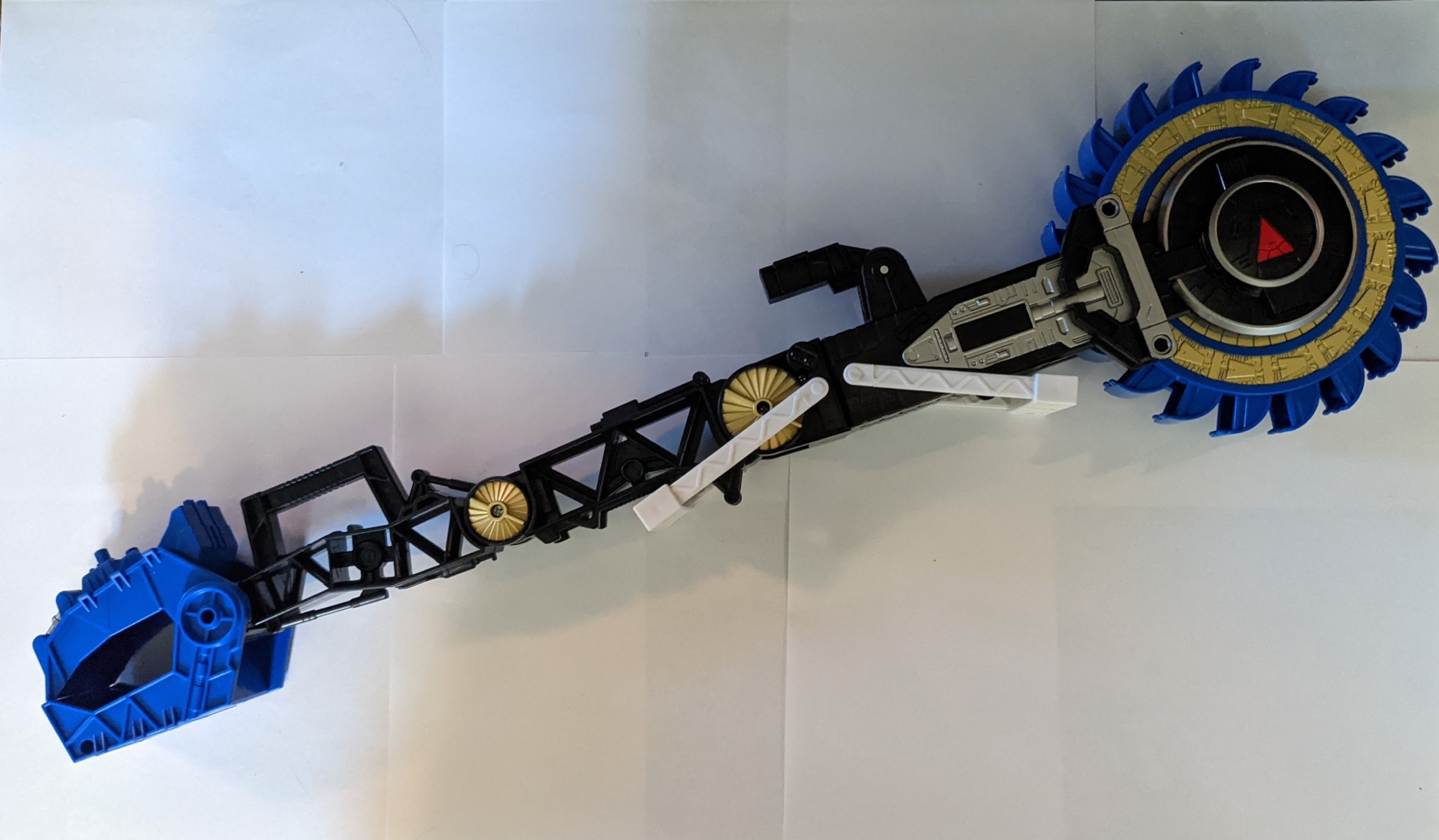 A picture of Metroplex's Sparkdrinker axe.