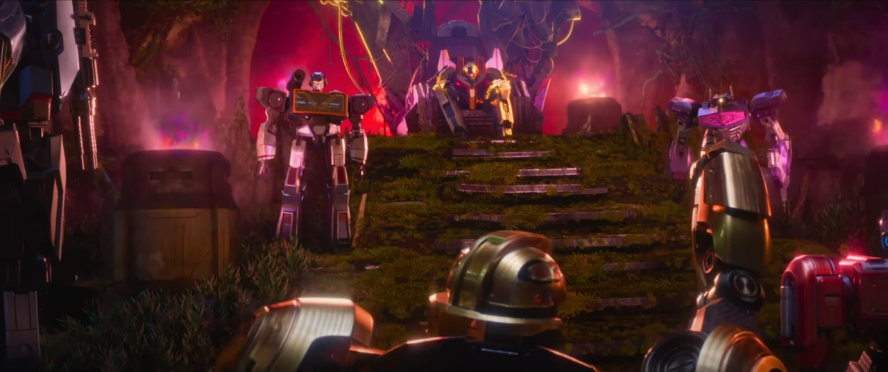 A shot from Transformers One, with B-127 identifying the various members of the Cybertronian High Guard.