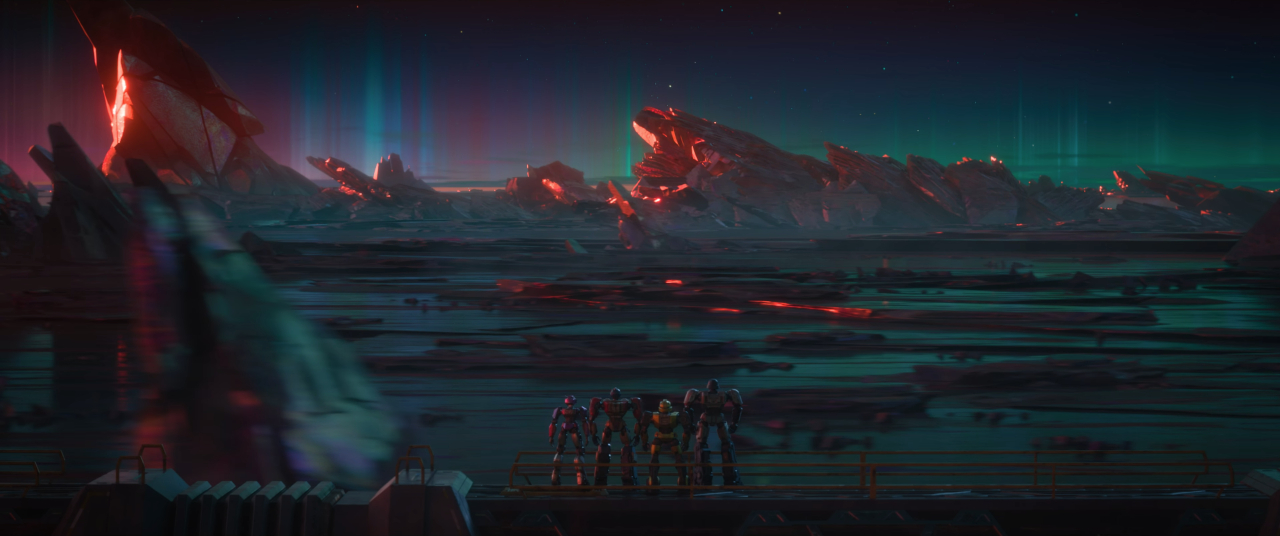 A shot from Transformers One, with Orion Pax and friends atop an Energon train on Cybertron's surface.