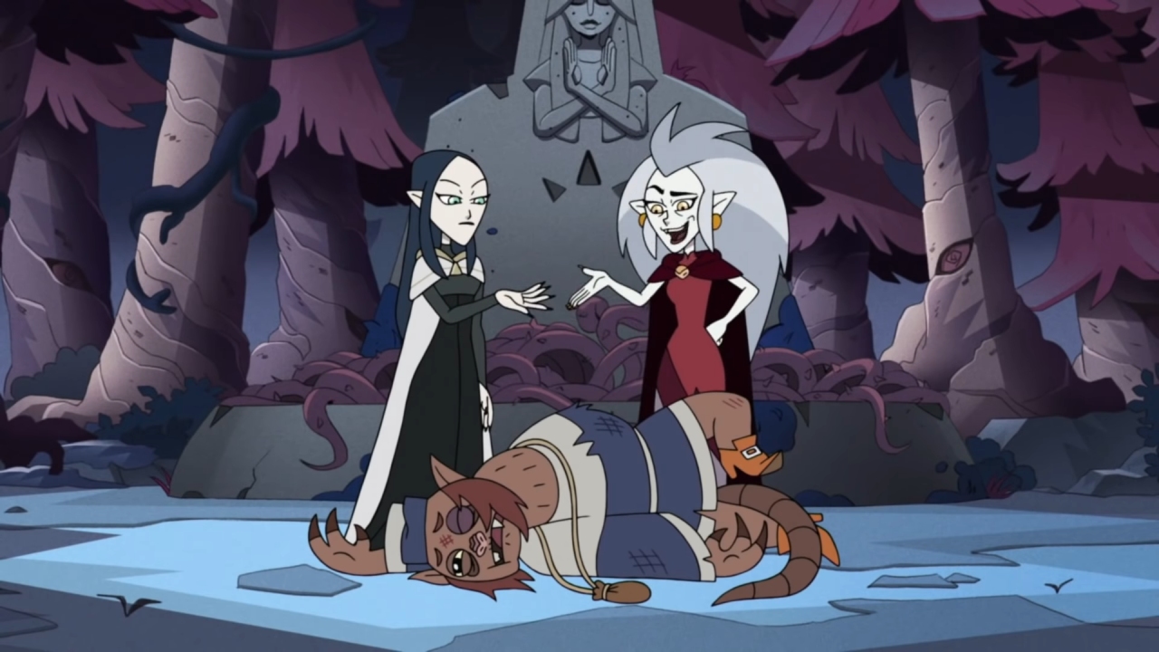 A screenshot from Sense and Insensitivity, with Eda and Lilith standing over the defeated merchant.