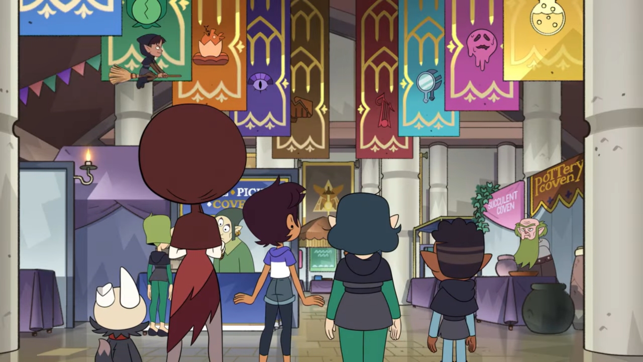 A screenshot from Covention, with Luz and friends looking up at banners for the nine main covens.