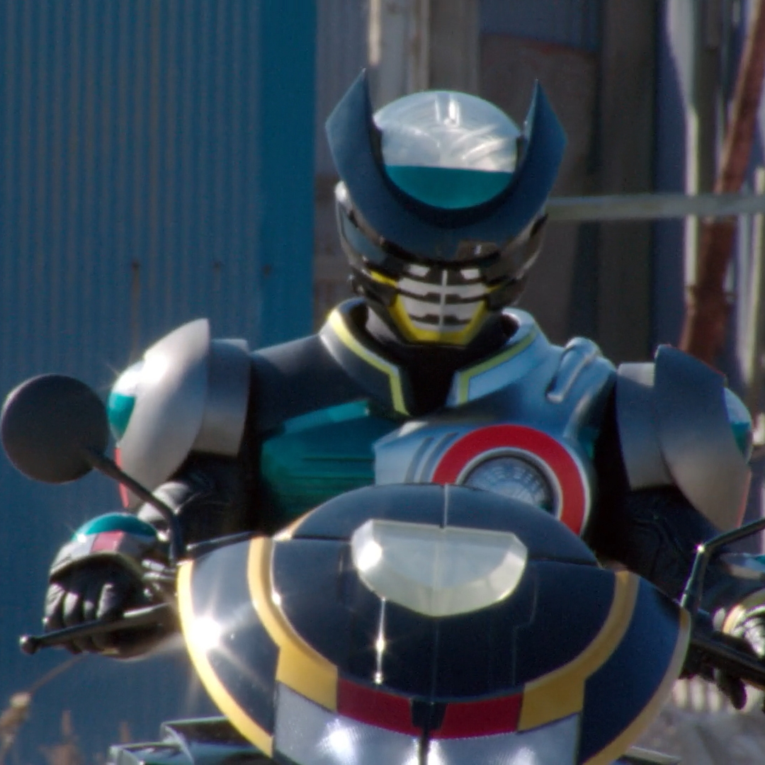 A cropped shot of Kamen Rider Birth Prototype on a Ridevendor from Super Hero Taisen.